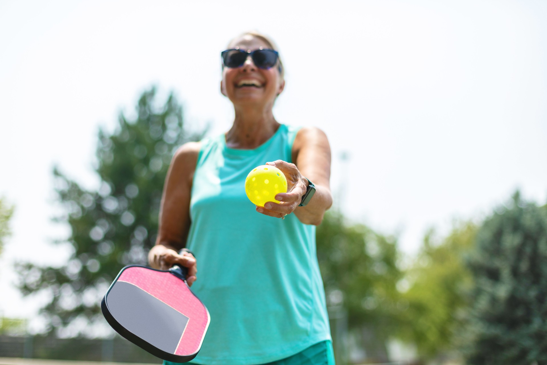 Mature Adult Female Playing Pickle Ball Photo Series