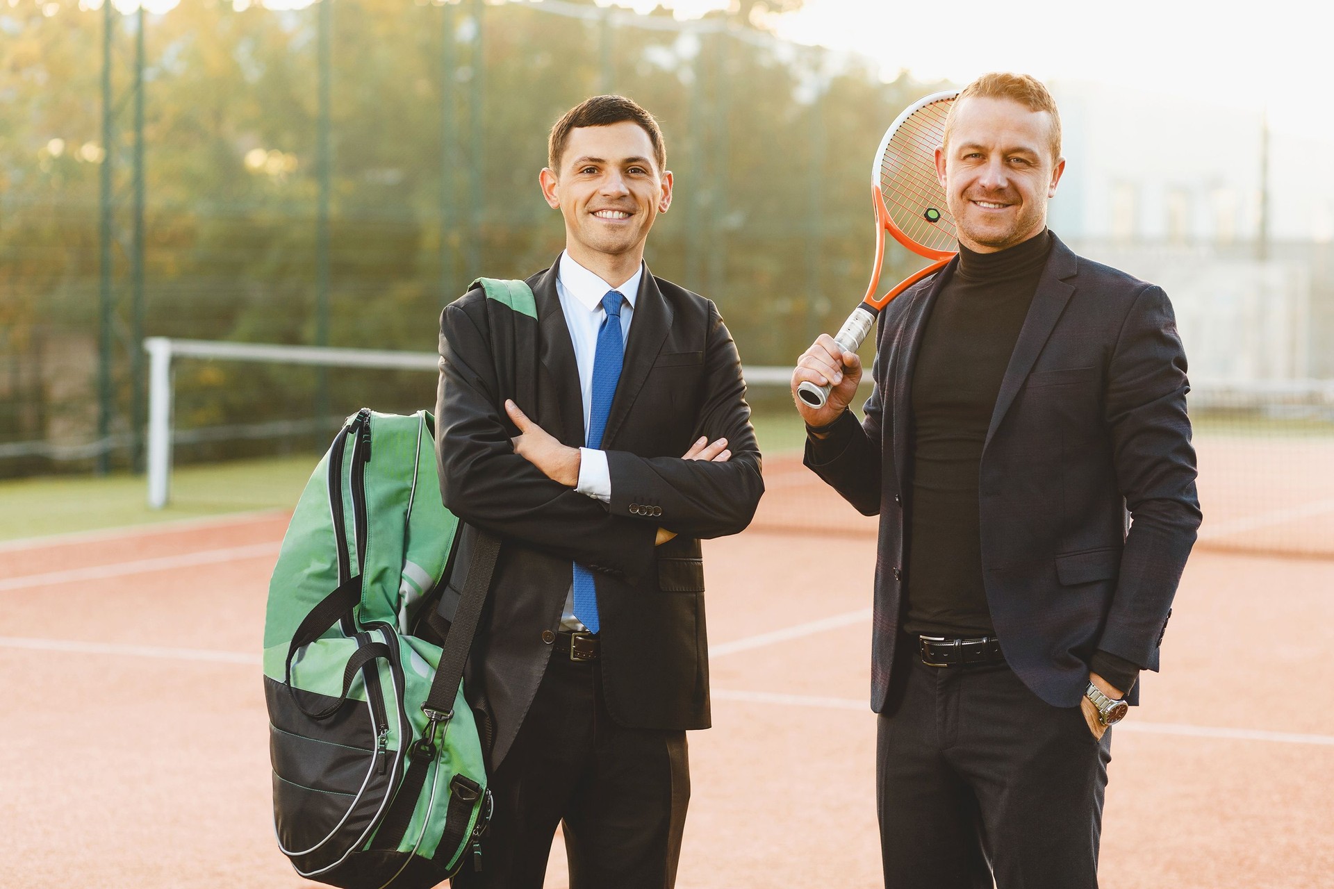 Business partners practicing tennis portrait